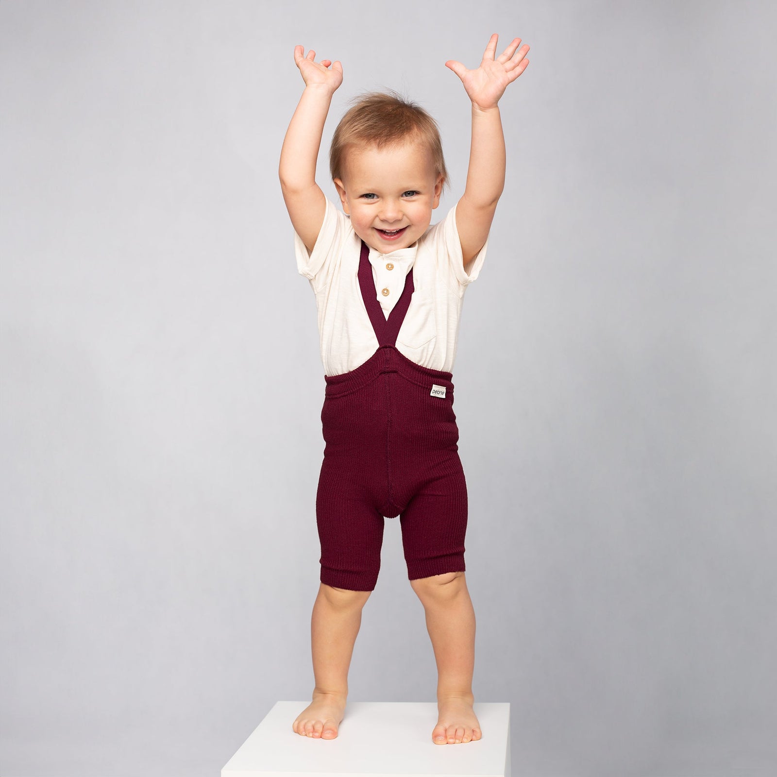 Red Peqne children’s shorts in a kids’ studio photoshoot